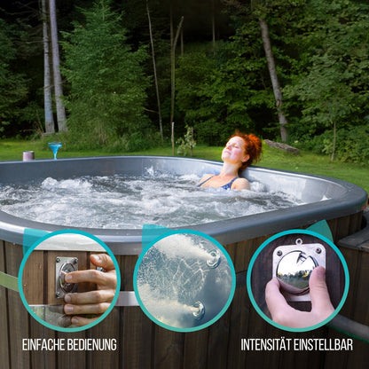 A square-shaped wood fired hot tub with metallic insert and a woman relaxing