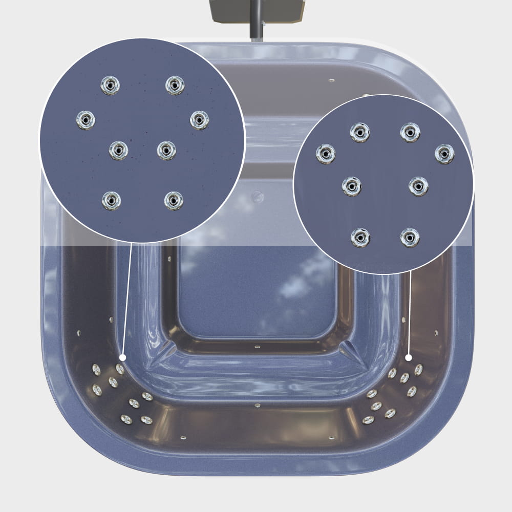 A closer view of the hydro jets in the gray square insert, arranged in the corners furthest from the heater—8 jets on each of the two walls
