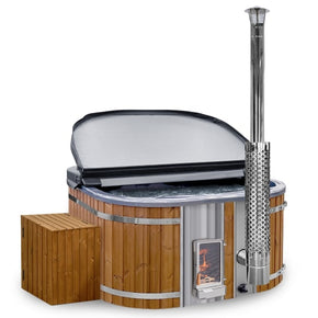 Side view of wooden hot tub with integrated stainless steel stove, chimney, wooden steps, and partially open cover