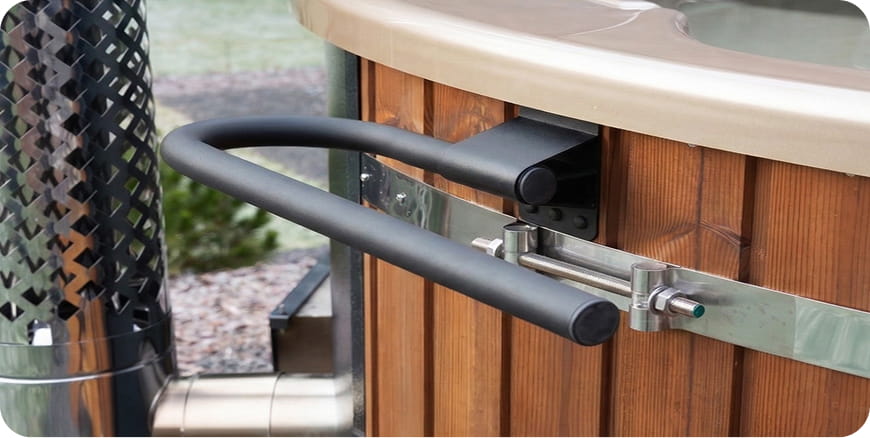A towel bar attached to the wooden hot tub