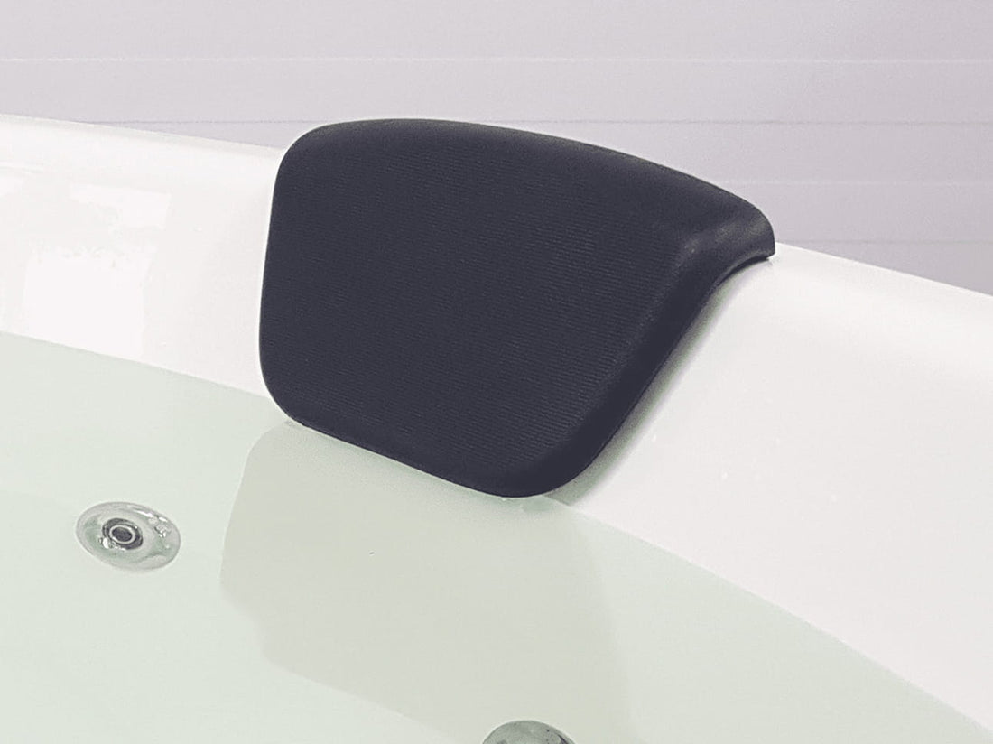 Black headrest on a white hot tub with a gray background